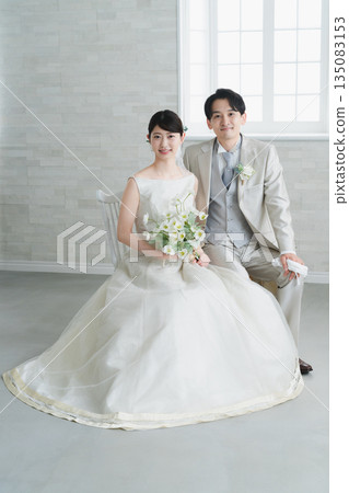Bride in a dress and groom in a tuxedo Wedding image Bride in a dress and groom in a tuxedo Wedding image 135083153