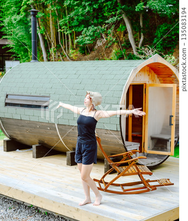 A woman takes a deep breath outdoors (Photo courtesy of Oki Seaside Resort Miyabi) 135083194