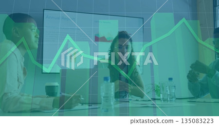 Reviewing chart display, woman wearing glasses leading discussion at conference room, with laptops 135083223