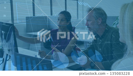 Pointing business professionals analyzing data on computer monitor in modern office, with charts Pointing business professionals analyzing data on computer monitor in modern office, with charts 135083228