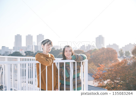 Couple looking outside on the rooftop 135083264