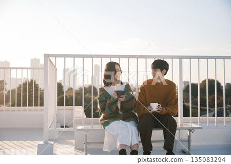 Couple relaxing on the rooftop 135083294