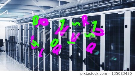 Displaying servers behind glass doors humming in data center, with cable trays, black swivel chair 135083450