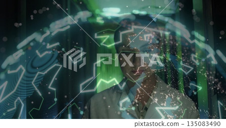 Female researcher in lab coat analyzing holographic globe in tech lab, with hexagonal overlays Female researcher in lab coat analyzing holographic globe in tech lab, with hexagonal overlays 135083490