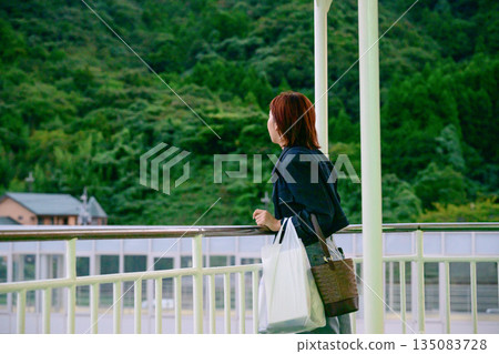 A woman looks at the view 135083728