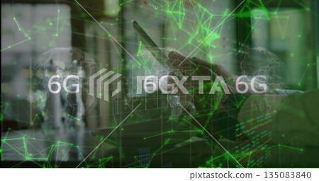 Professional using tablet in office with holographic world map, 6G network and monitors, copy space Professional using tablet in office with holographic world map, 6G network and monitors, copy space 135083840