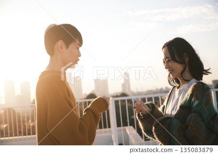 Couple on the rooftop at dusk 135083879