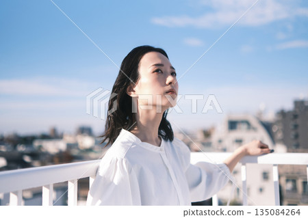 Rooftop portrait of a young woman Rooftop portrait of a young woman 135084264