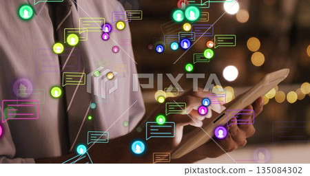 Using tablet, person in school with colorful image of social media notifications Using tablet, person in school with colorful image of social media notifications 135084302