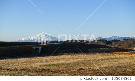 Mount Chokai and the Tohoku Chuo Expressway under construction near the temporary Showa Interchange, December 2025, Yamagata Prefecture 135084501
