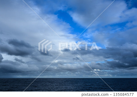 Cloudy sky and dark sea Cloudy sky and dark sea 135084577