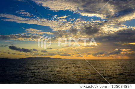 sunset sea and island 135084584