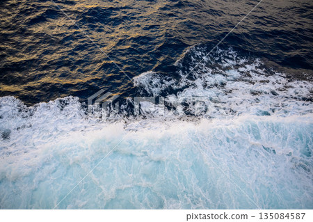 Waves flowing alongside the boat Waves flowing alongside the boat 135084587