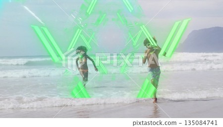 Running siblings wearing swimwear, goggles and snorkel mask, splashing at shoreline, green overlay Running siblings wearing swimwear, goggles and snorkel mask, splashing at shoreline, green overlay 135084741