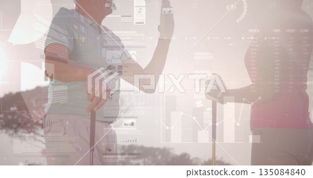 Clinking bottles couple wearing polo shirts and golf trousers on fairway, with golf clubs and glove 135084840