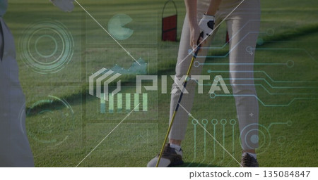 Student practicing putt with coach watching on golf green, with golf putter net digital graphics Student practicing putt with coach watching on golf green, with golf putter net digital graphics 135084847