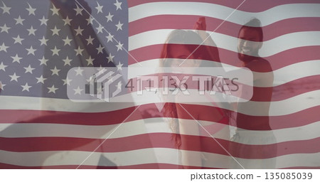 Three adults in athletic wear performing workout in studio, with US flag overlay and 411,136 LIKES Three adults in athletic wear performing workout in studio, with US flag overlay and 411,136 LIKES 135085039