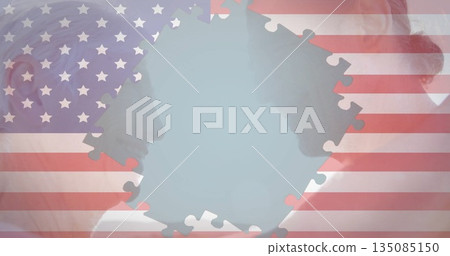 Displaying older man and woman profiles facing each other in studio, with US flag puzzle piece Displaying older man and woman profiles facing each other in studio, with US flag puzzle piece 135085150