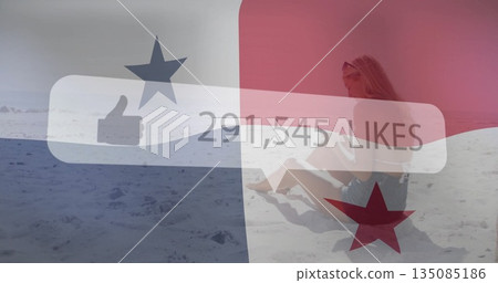 Sitting woman holding smartphone wearing sunglasses on sand dune under likes overlay, copy space Sitting woman holding smartphone wearing sunglasses on sand dune under likes overlay, copy space 135085186