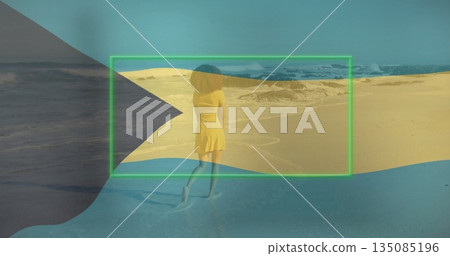 Woman wearing yellow dress walking on beach, leaving footprints with ocean waves, tinted overlays Woman wearing yellow dress walking on beach, leaving footprints with ocean waves, tinted overlays 135085196