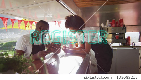 Discussing baristas in aprons pointing at smartphone on coffee cart counter with espresso machine Discussing baristas in aprons pointing at smartphone on coffee cart counter with espresso machine 135085213