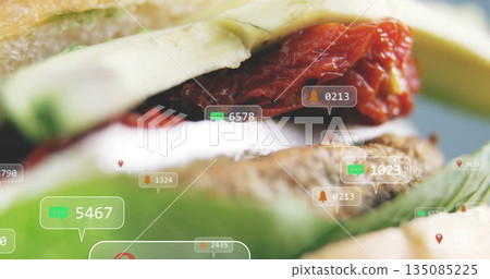 Showing sandwich with lettuce, sundried tomatoes, avocado on counter, with notification icons Showing sandwich with lettuce, sundried tomatoes, avocado on counter, with notification icons 135085225