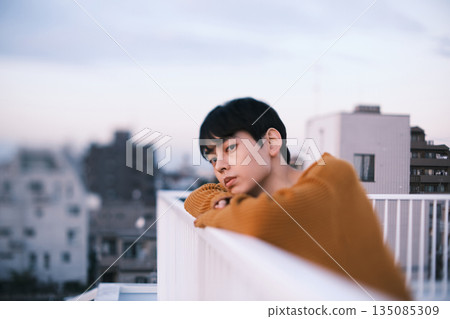 Portrait of a man on a rooftop at dusk 135085309