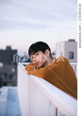 Portrait of a man on a rooftop at dusk Portrait of a man on a rooftop at dusk 135085310