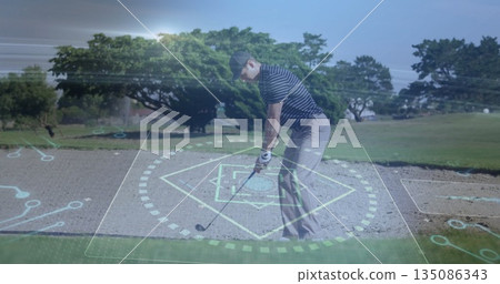 Swinging golfer in golf clothes hitting ball with club in bunker on course with holographic overlay Swinging golfer in golf clothes hitting ball with club in bunker on course with holographic overlay 135086343
