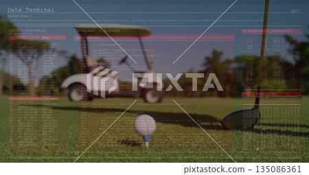 Displaying white golf ball balancing on tee on fairway, with club head, golf cart, terminal overlay Displaying white golf ball balancing on tee on fairway, with club head, golf cart, terminal overlay 135086361