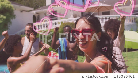 Dancing woman in red sunglasses leading friends around backyard pool, with heart overlay and towel Dancing woman in red sunglasses leading friends around backyard pool, with heart overlay and towel 135086461