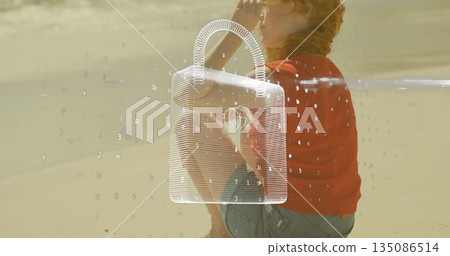 Shading eyes and gazing toward horizon, woman in red sweater on beach, with padlock graphic Shading eyes and gazing toward horizon, woman in red sweater on beach, with padlock graphic 135086514