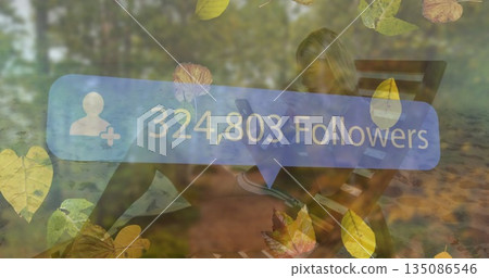 Checking smartphone woman in athletic wear on park bench among leaves, displaying 324,803 followers 135086546