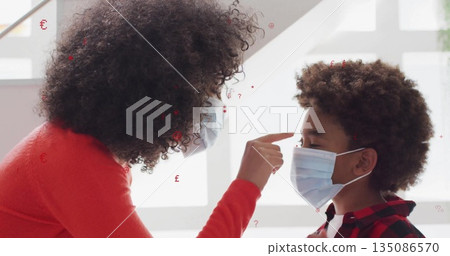 Leaning masked woman in red sweater pointing at boy's forehead at grid windows, with surgical masks Leaning masked woman in red sweater pointing at boy's forehead at grid windows, with surgical masks 135086570