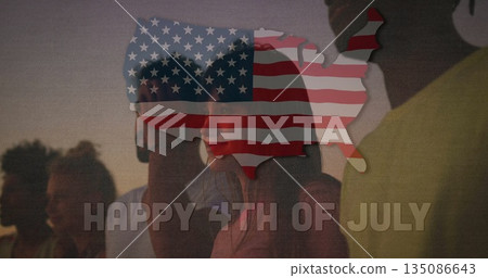 Standing group observing patriotic silhouette overlay in park at dusk, with stars and stripes motif 135086643