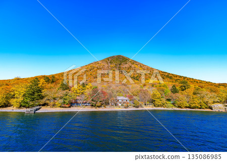 Lake Chuzenji in autumn, Nikko City, Tochigi Prefecture (Mount Nantai seen from a sightseeing boat) Lake Chuzenji in autumn, Nikko City, Tochigi Prefecture (Mount Nantai seen from a sightseeing boat) 135086985