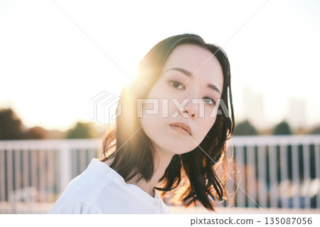 Portrait of a woman on a rooftop at dusk 135087056