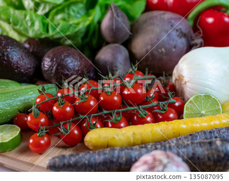 Assortment of fresh organic vegetables in baskets at a farmers market or supermarket. Healthy natural products for diet, clean eating, and sustainable lifestyle. Assortment of fresh organic vegetables in baskets at a farmers market or supermarket. Healthy natural products for diet, clean eating, and sustainable lifestyle. 135087095