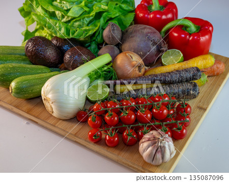 Assortment of fresh organic vegetables in baskets at a farmers market or supermarket. Healthy natural products for diet, clean eating, and sustainable lifestyle. Assortment of fresh organic vegetables in baskets at a farmers market or supermarket. Healthy natural products for diet, clean eating, and sustainable lifestyle. 135087096