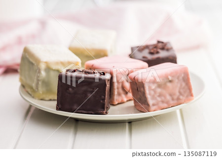 Sweet dessert cake. Mini pie on plate on white table. Sweet dessert cake. Mini pie on plate on white table. 135087119