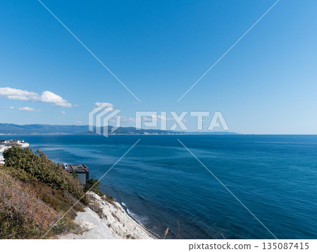 View of Tsemesskaya Bay from Mount Koldun in Myskhako near Novorossiysk, Russia, overlooking the Black Sea coastline, port area and mountainous landscape View of Tsemesskaya Bay from Mount Koldun in Myskhako near Novorossiysk, Russia, overlooking the Black Sea coastline, port area and mountainous landscape 135087415