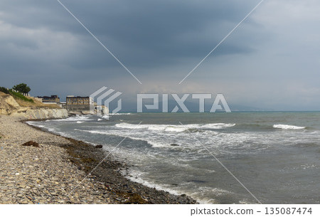 Myskhako beach in Russia with the sea and resort area, showing coastal recreation, tourism infrastructure and summer seaside life 135087474