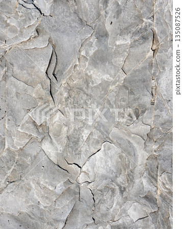 Close-up view of natural stone texture, showing detailed rock surface and rough structure, suitable as background or abstract natural pattern Close-up view of natural stone texture, showing detailed rock surface and rough structure, suitable as background or abstract natural pattern 135087526