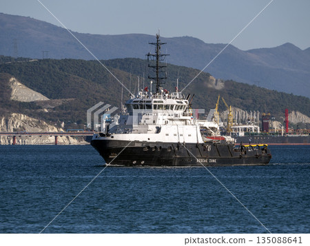 August 22 2025 View of Novorossiysk port Russia with cargo ships and cranes on the coastline. Industrial maritime scene on the Black Sea August 22 2025 View of Novorossiysk port Russia with cargo ships and cranes on the coastline. Industrial maritime scene on the Black Sea 135088641