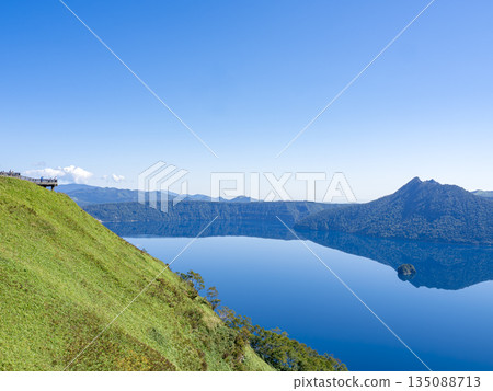 Lake Mashu's mirror-like surface in the morning, seen from the third observation deck in late September Lake Mashu's mirror-like surface in the morning, seen from the third observation deck in late September 135088713