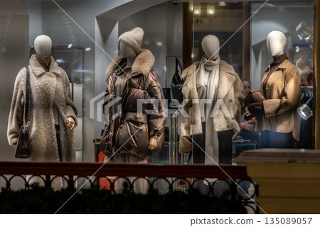 Winter Fashion Display Of Cozy Coats And Accessories In A Boutique Window 135089057