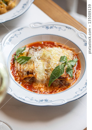 Classic lasagna with tomato sauce and cheese Classic lasagna with tomato sauce and cheese 135089139