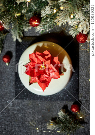 Festively Decorated Dessert Featuring a Vibrant Flower Centerpiece Perfect for Holiday Celebrations and Events Festively Decorated Dessert Featuring a Vibrant Flower Centerpiece Perfect for Holiday Celebrations and Events 135089323