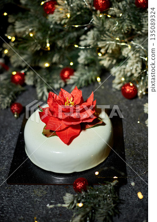 Festively Decorated Dessert Featuring a Vibrant Flower Centerpiece Perfect for Holiday Celebrations and Events Festively Decorated Dessert Featuring a Vibrant Flower Centerpiece Perfect for Holiday Celebrations and Events 135089324