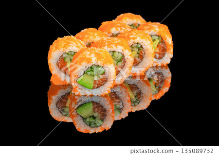 Vibrant sushi rolls covered in bright orange tobiko are filled with fresh salmon, avocado, and crisp cucumber, presented on a glossy black reflective surface Vibrant sushi rolls covered in bright orange tobiko are filled with fresh salmon, avocado, and crisp cucumber, presented on a glossy black reflective surface 135089732